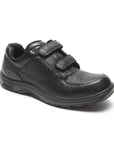 Black leather shoes with two adjustable Velcro straps.