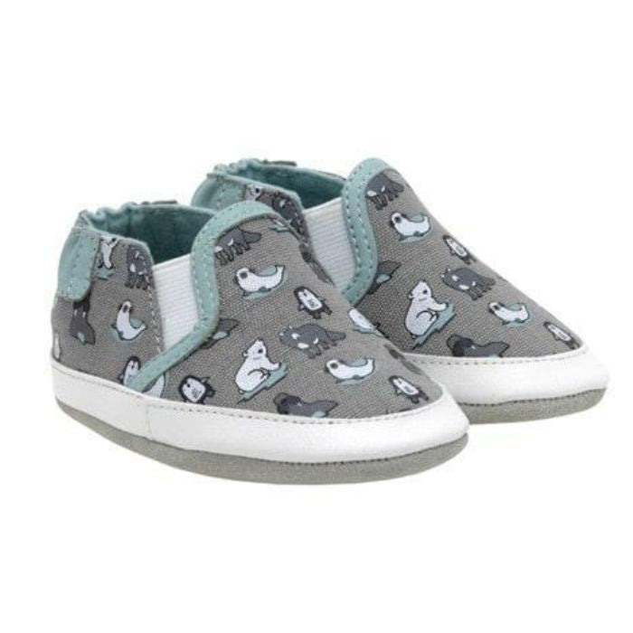 Gray baby shoes with soft soles featuring a variety of artic mammals playing in the ice.