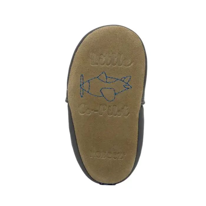 Beige Suede outsole with a blue airplane in middle and "Little Co-pilot" stamped around it.