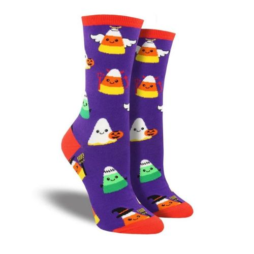 Socksmith Women's Corny Costumes Socks in purple featuring candy corn characters in Halloween outfits. Shop at White-Balmer Shoes.