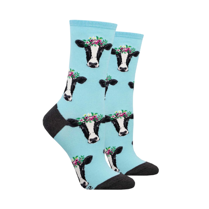 Blue socks with cows wearing flower headbands.