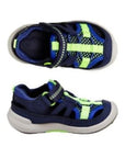 Top and side view of navy fisherman sandal with green accents.