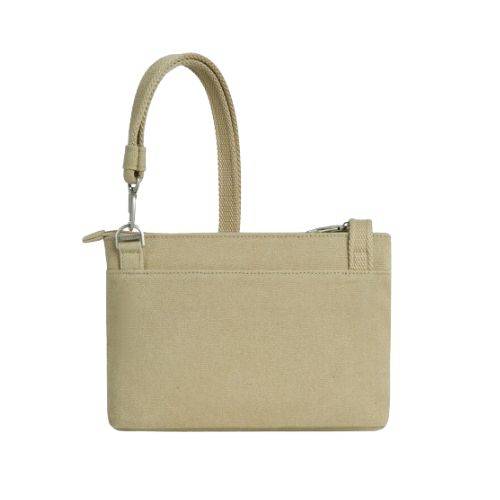 Back view of the beige Heritage Anti-Theft Crossbody Bag highlighting its minimalist design and durable fabric for everyday wear.