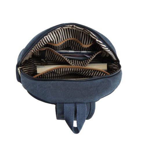 Interior view of Travelon Anti-Theft Sling Bag showing organized compartments, RFID pocket, and striped lining for secure and stylish storage.