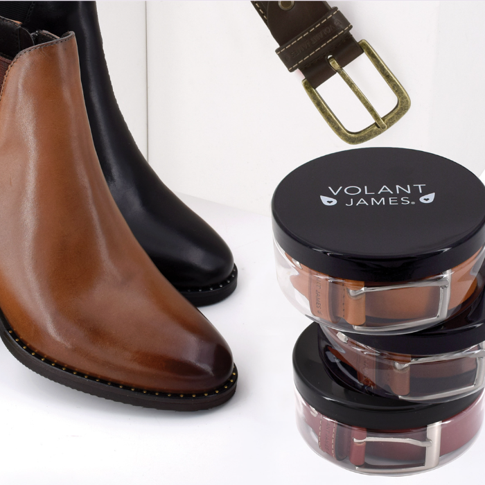 Brown and black leather boots with a belt and Volant James containers.