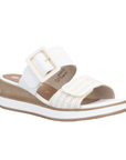 White wedge slide sandal with a white buckle strap, gold accents, woven over-the-toe Velcro strap, tan Remonte logo'd footbed, white midsole and tan outsole.