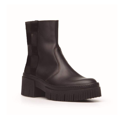 Black boot with a thick sole on a white background