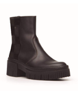 Black boot with a thick sole on a white background