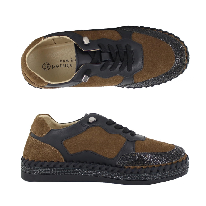 Pair of low-top sneakers with brown suede and black leather panels, black elastic laces, a black whip-stitch midsole, bedazzled toe wrap and midsole around black platform outsole.
