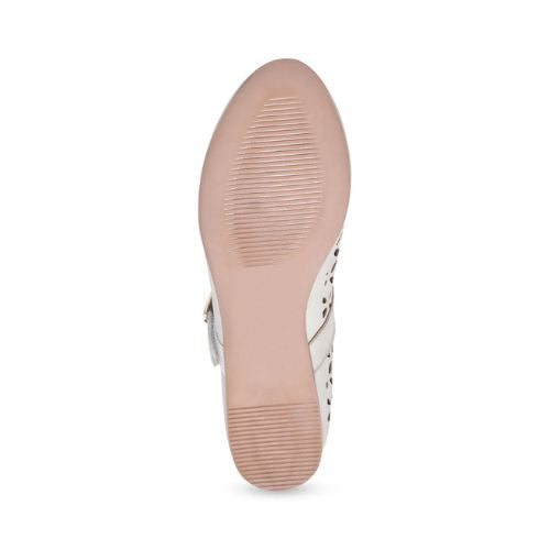 Tan light treaded outsole of Mary Jane shoe.