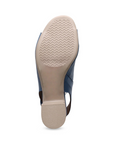 Tan wave pattern tread on block heel sandal's outsole.