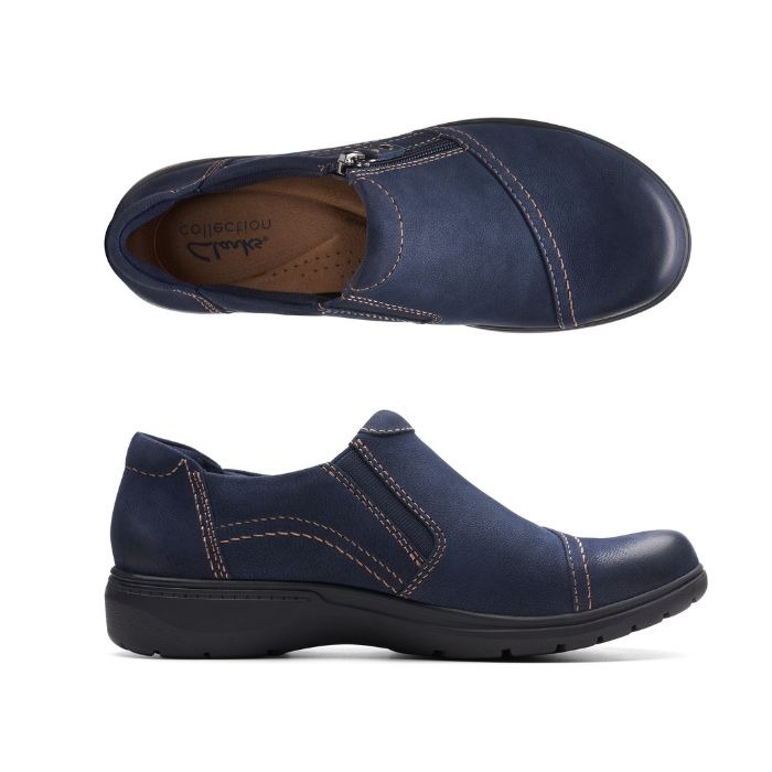 Navy nubuck shoe with zipper closure, beige top stitching and black rubber outsole. Clarks logo on center of heel.