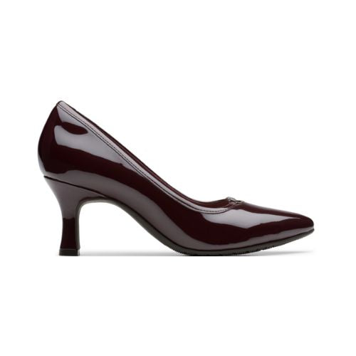 Deep Merlot red patent leather kitten heel with pointed toe and black rubber outsole.