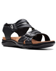 Black backstrap sandal with two adjustable Velcro straps with scrunched details, small silver embellishments, tan Clarks logo'd footbed and black outsole.