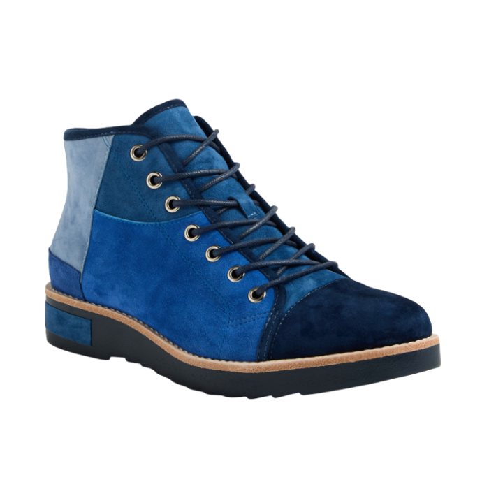 A high-top patchwork ankle boot featuring suede panels in varying shades of blue, with  blue laces and a black outsole.