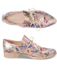 Pair of Women's Oxford shoes in floral gold metallic leather with lace-up slip on style and a low stacked heel.