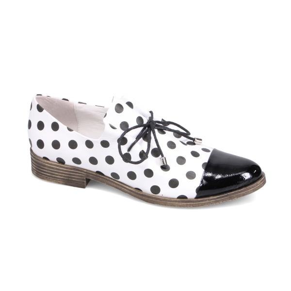 Woman's Oxford shoe in white with black polka dotted leather with black laces, slip on style, black patent toe cap and a low stacked heel.