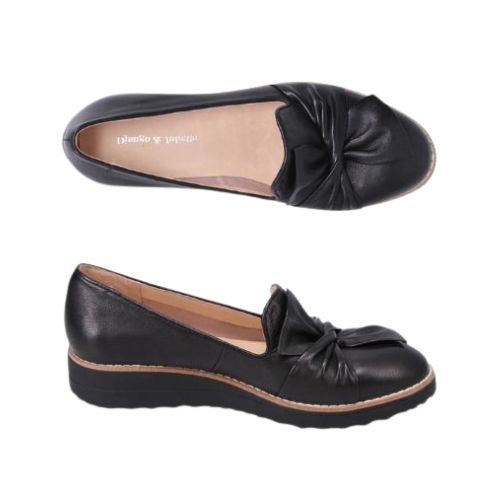 Pair of A black leather loafers with a scrunchy bow detail on the vamp and a low wedge heel.
