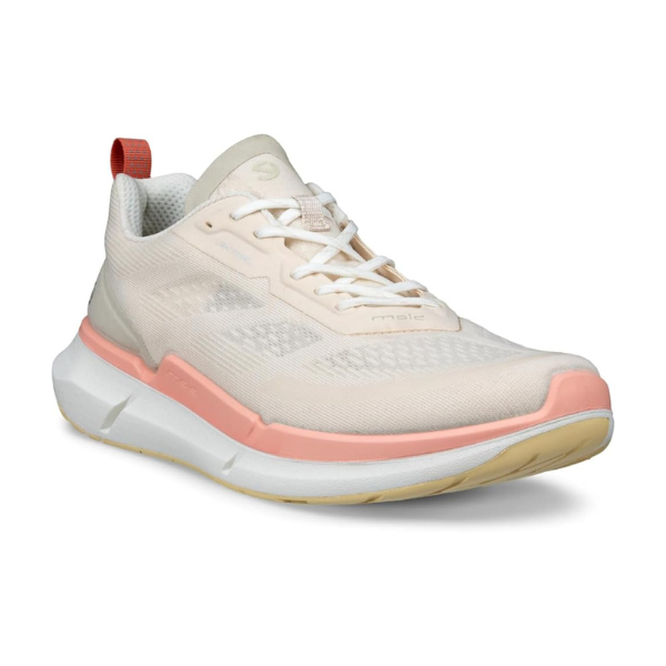 An Ecco light tan mesh sneaker with pink midsole and beige outsole. Laces are white and there is a pink heel tab.