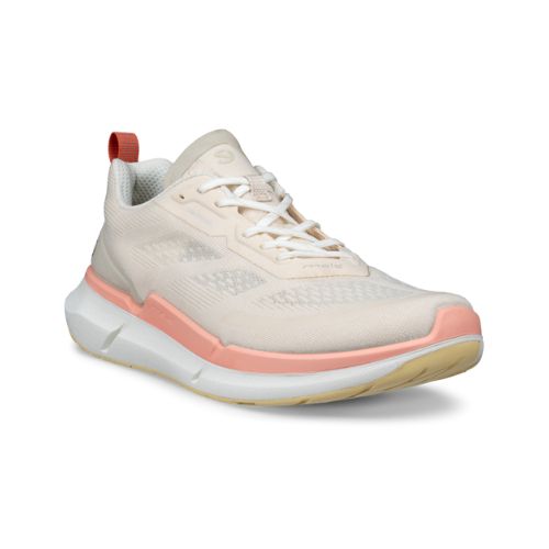 An Ecco light tan mesh sneaker with pink midsole and beige outsole. Laces are white and there is a pink heel tab.
