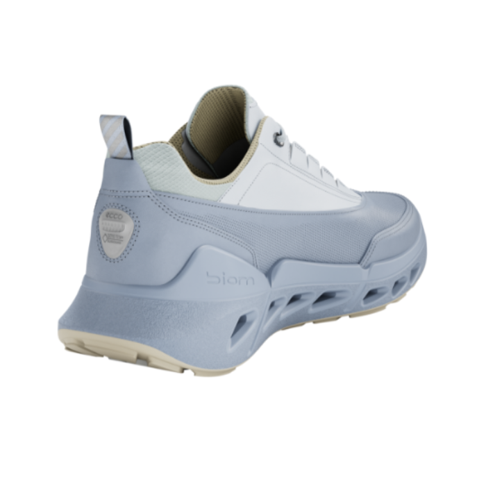 Heel counter of Blue sporty sneaker with light blue accents, thick unique midsole and tan outsole.