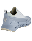 Heel counter of Blue sporty sneaker with light blue accents, thick unique midsole and tan outsole.