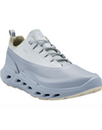 Blue sporty sneaker with light blue accents, thick unique midsole and tan outsole.