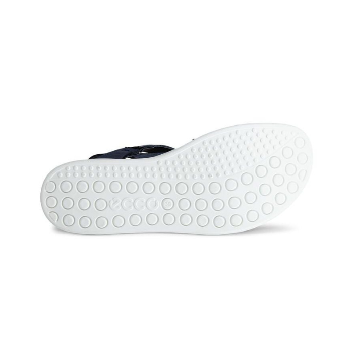 White light treaded outsole with circle patterns and Ecco logo stamped in middle.
