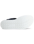 White light treaded outsole with circle patterns and Ecco logo stamped in middle.