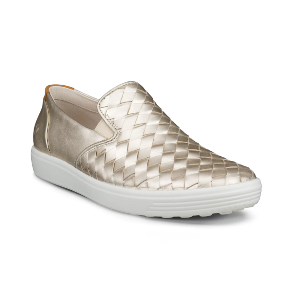 An Ecco Slip-On Sneaker with gold thatched appearance with a smooth leather gold heel and a white outsole. 