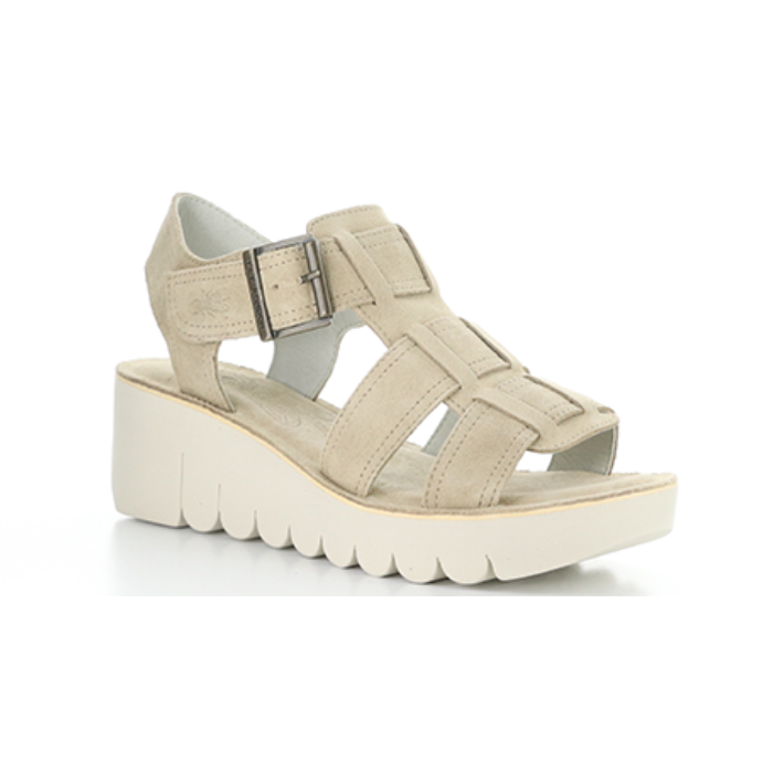 Taupe suede gladiator style sandal with detail stitching and a lugged platform outsole.