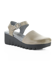 Taupe closed toe sandal with backstrap, grey footbed and a lugged black wedge platform.