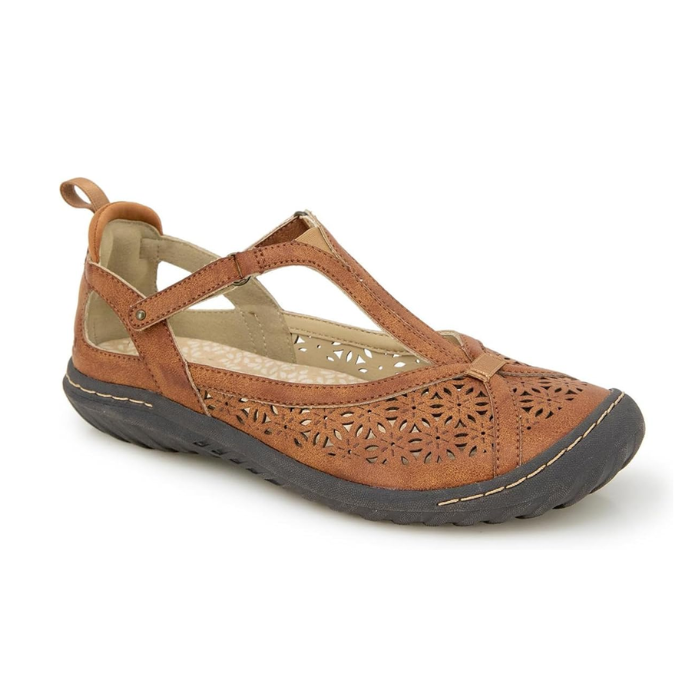 A Mary-Jane Flat with floral cut-out design, adjustable strap, and durable outsole.