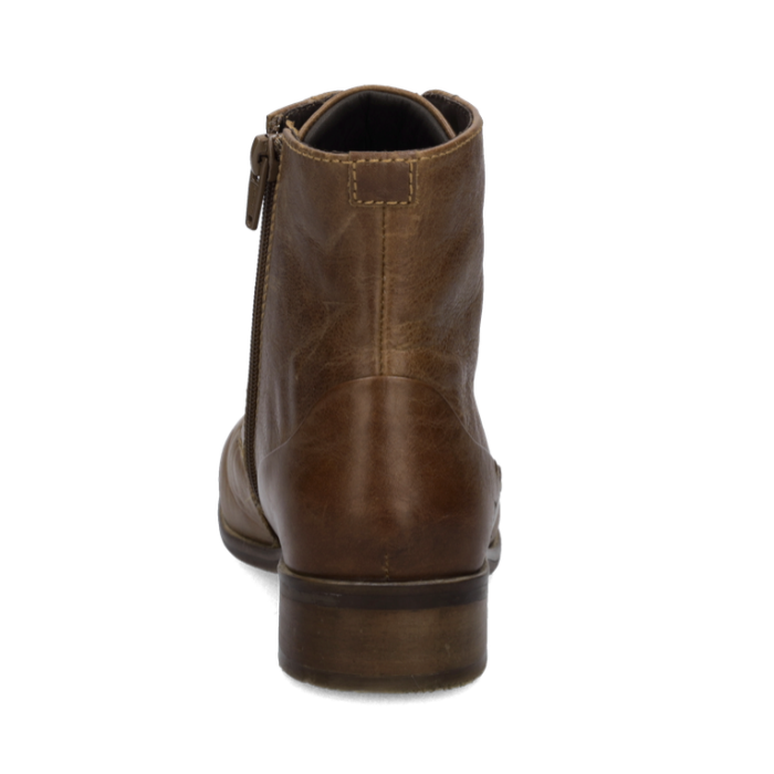 A brown leather ankle boot shown from a rear three-quarter view, featuring a low block heel and a side zipper pull, set against a plain white background.