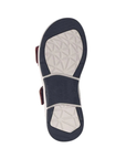 Navy and white outsole of sandal with geometric tread patterns.