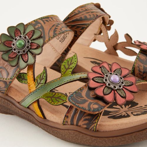 Close-up of the Women&#39;s L&#39;Artiste Aymee Sandal highlighting colorful hand-painted leather flowers and leaf accents on the straps.