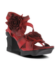 Heeled sandals in hand-painted red leather with 3D flower accents and a sculpted black wedge heel.