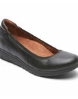 Black leather flat with small wedge outsole.