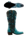 Pair of tall western cowboy boots with a teal blue floral patterned shaft, a solid teal blue embossed leather vamp, inside full length zipper, silver studded wrap detail and low block heel.