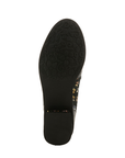 Black rubber outsole with a flower and vine tread pattern at the ball of the foot and a light treaded low block heel.