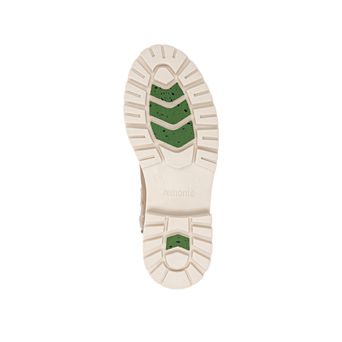 White lugged outsole with ice grip green sections and Remonte logo stamped in heel.