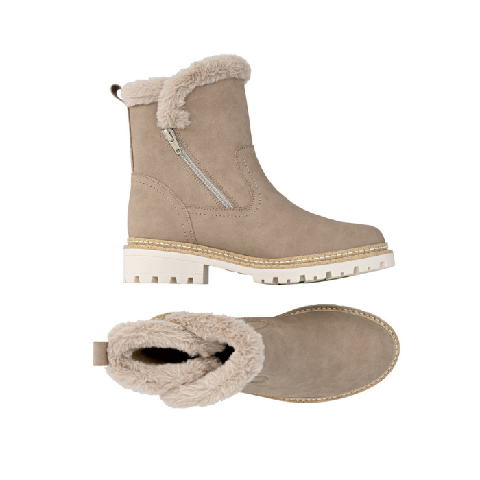 Pair of beige winter boots with fur trim, detail stitching and white lugged outsole.