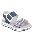 Navy and white backstrap sandal with a zig-zag striped strap and white square buckle on white and blue striped platform outsole.
