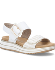 White backstrap sandal with a zig-zag striped gold strap and white square buckle on white and gold striped platform outsole.
