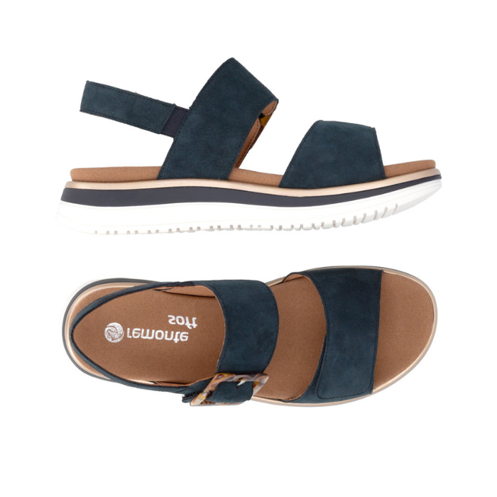 Pair of Navy backstrap sandals with brown marble buckle, tan Remonte logo'd footbed and white outsole.