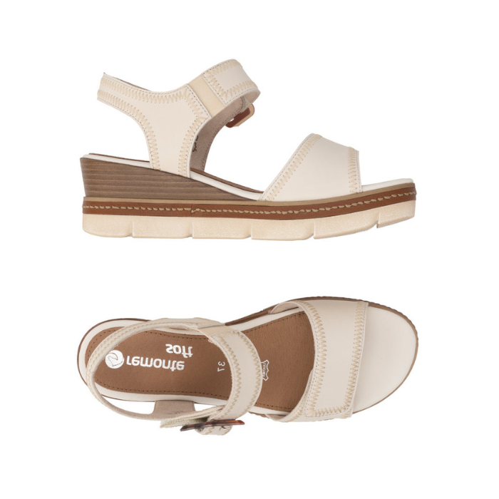 Pair of Beige wedge sandals with brown buckle, accent zig-zag stitching, tan Remonte logo'd footbed and off-white outsole.