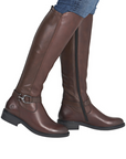 Brown knee-high boots with a buckle on ankle worn with blue jeans.