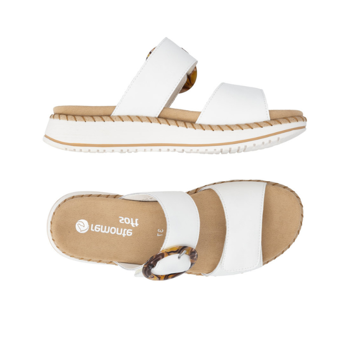 Pair of White slide sandals with two Velcro straps, marbled circle buckle, tan Remonte logo'd footbed, and a white platform with beige accents.