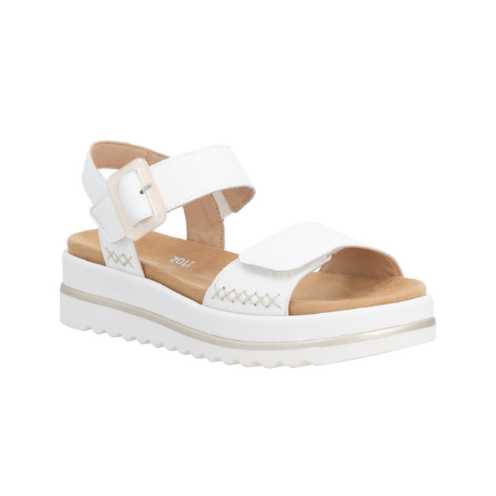 White backstrap sandal with beige buckle detail. accent "X" stitching, tan Remonte logo'd footbed and white outsole.