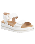 White backstrap sandal with beige buckle detail. accent "X" stitching, tan Remonte logo'd footbed and white outsole.